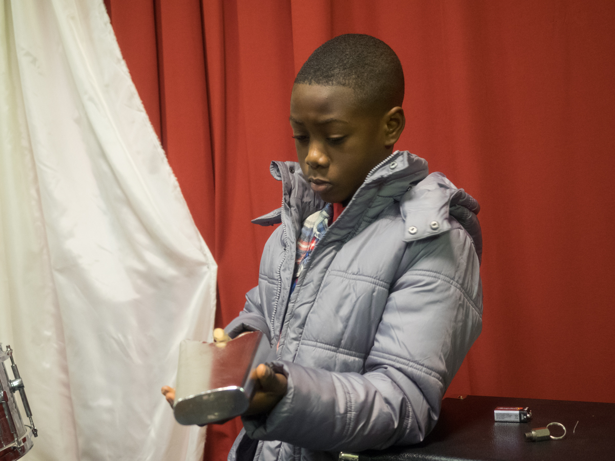 Gabriel Opoku play the percussion